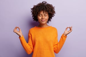 Calm woman with orange sweater